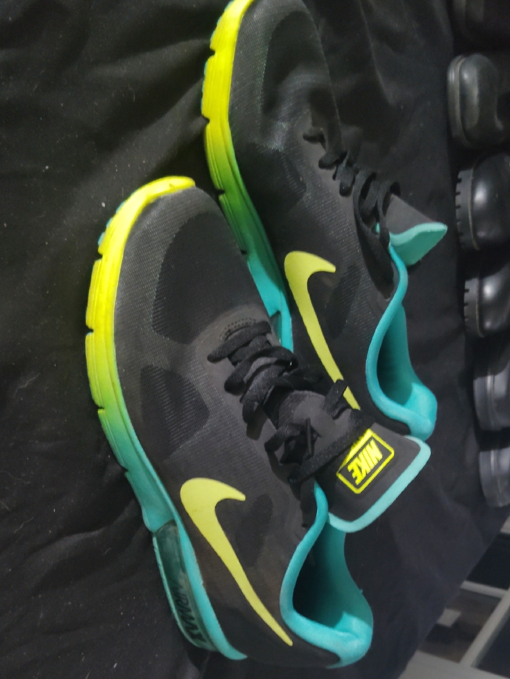 Nike Black Sneakers with Yellow Swoosh and Teal Accents